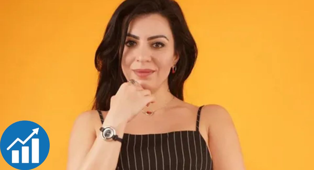 Person with long dark hair wearing a black pinstriped top, standing against an orange background with a growth analytics icon.