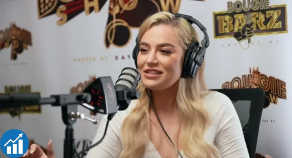 Blake Blossom speaking into a microphone during a podcast interview on The Bougie Show