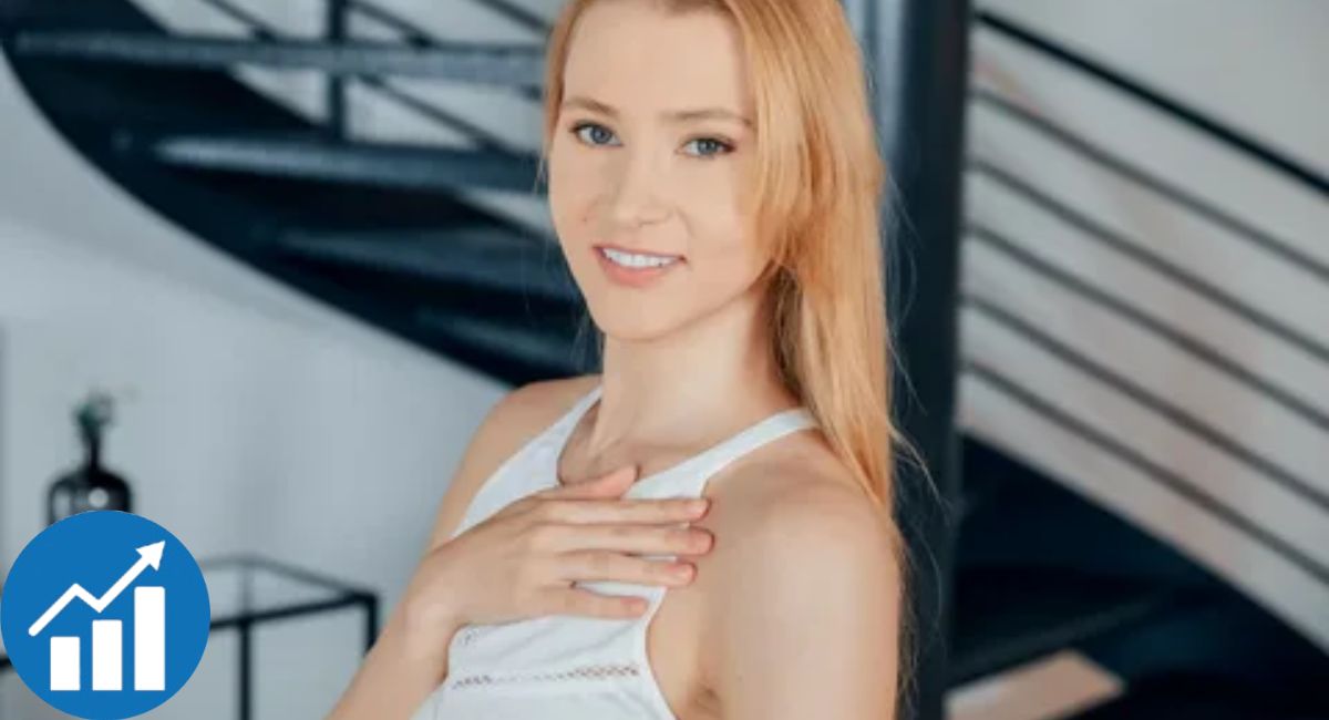 Ivi Rein by a modern staircase with growth icon