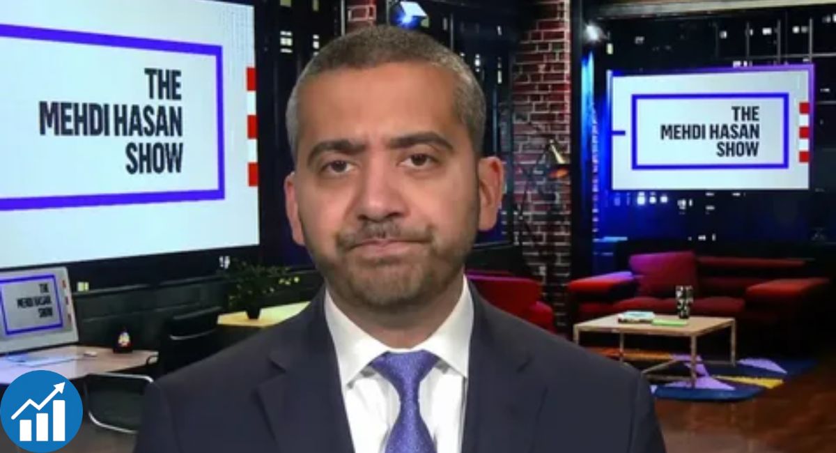 Mehdi Hasan seated in a television news studio during a political discussion in 2026