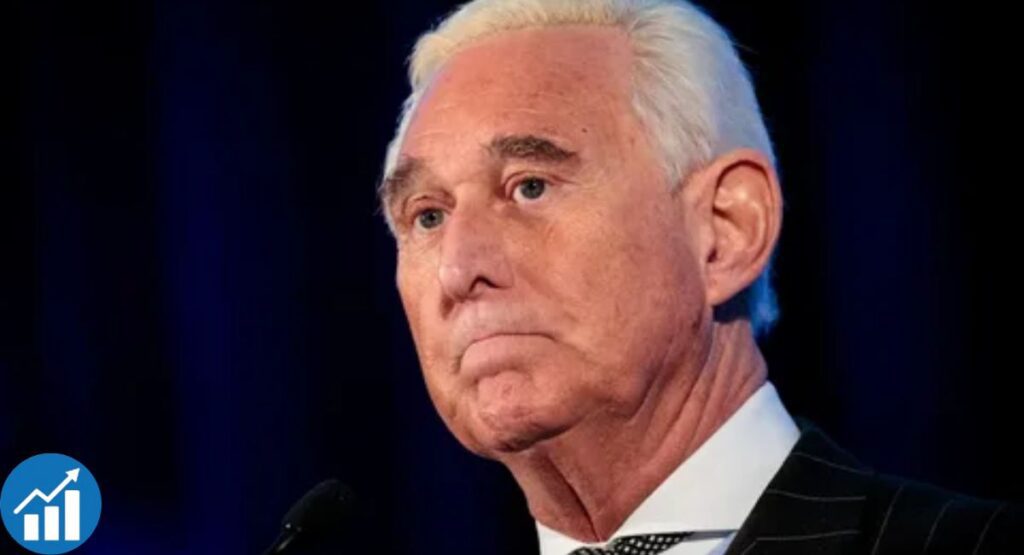 Roger Stone in a colorful suit with slicked-back hair at a political event